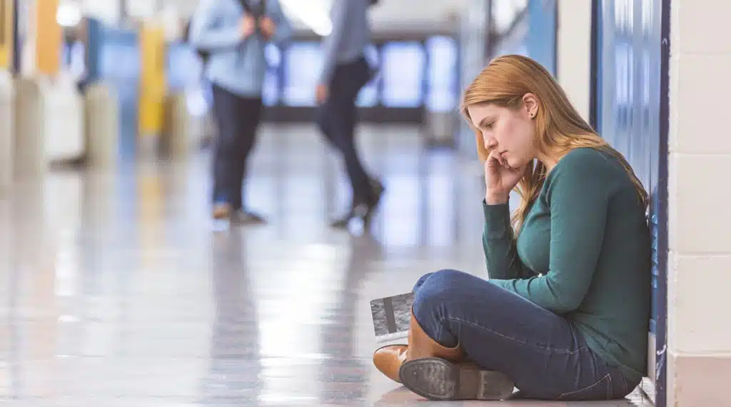 teen girl experiencing college rejection depression