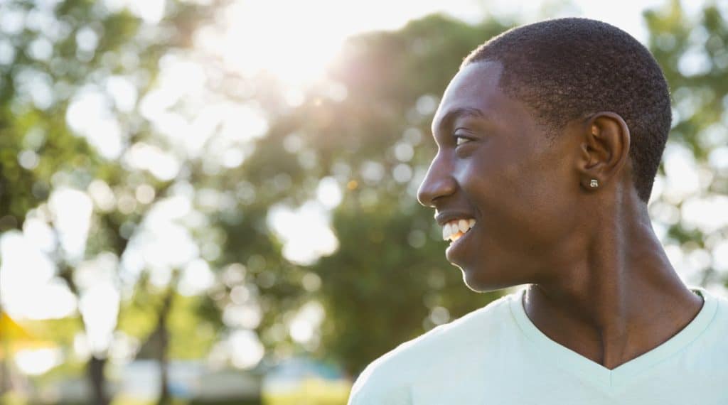 Young man experiencing better well-being after teen counseling