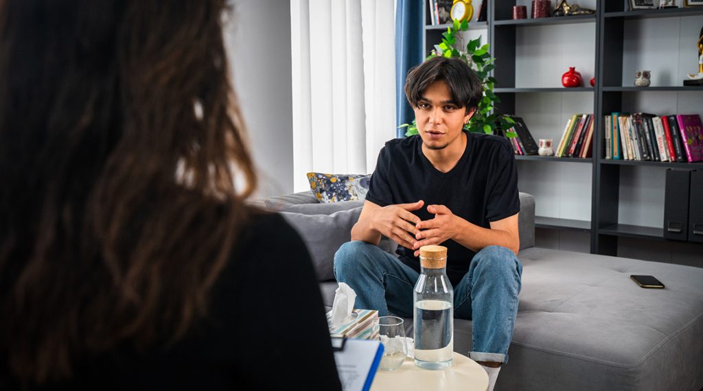 Teen boy in therapy: Teen substance use treatment is stage 5 of the 5 stages of teen drug addiction